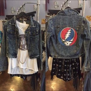 Jean jacket with Grateful Dead graphic.